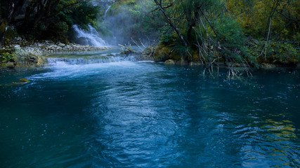 Fototapeta na wymiar Waterfall and Lake within the colorful Plitvice National Park in Croatia