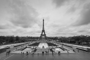 Eiffel Tower with dramatic sky seen from Trocadero square. UNESCO World Heritage Site. Paris landmark in black and white.