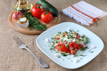 Fresh tomato salad with herbs and cheese.