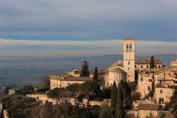 assisi is a city in Umbria, in Italy. It is surrounded by hills, olive groves and vineyards