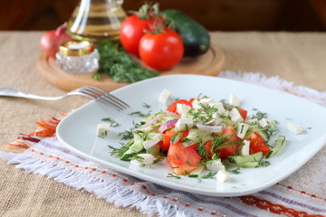 Fresh tomato salad with herbs and cheese.