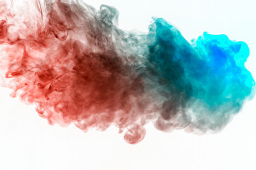 Waves of tinted smoke in blue and red on a white background, scattered in the form of a decorative ornament. Color transition in substance molecules.