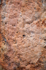Red rough stone wall