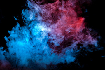 Dense exhaled violet blue and white smoke on a black background texturally smoothly collapsing into a rising column of vapor from the vape.