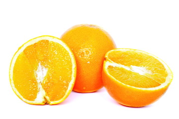 Two halves and whole yellow juicy fresh orange on white background. Isolated