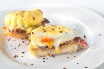 Eggs Benedict on the white plate