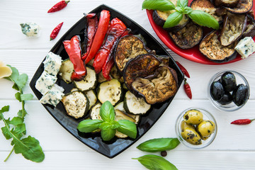 Grilled vegetables on white table.