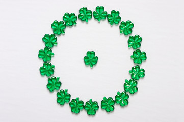 Glass shamrocks in circle frame with copy space