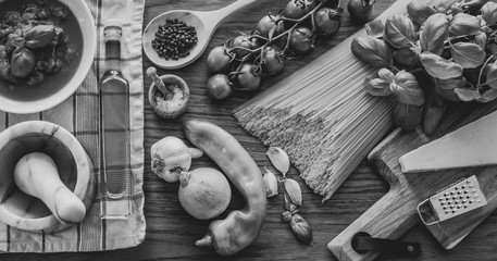 Italian food ingredients. Spaghetti, cheese and vegetables. Black and white photo.