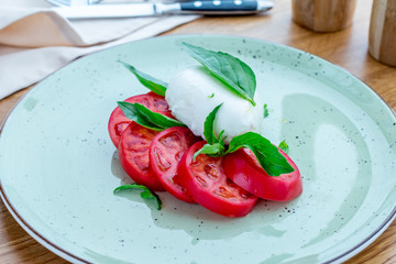 Caprese salad with mozzarella and tomato