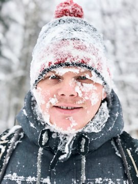 Close Up Portrait Of Man With Frozen Snowy Face And Hat