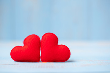Fototapeta premium red couple heart shape decoration on blue wooden table background. Wedding, Romantic and Happy Valentine’ s day holiday concept