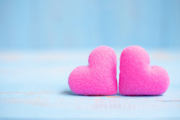 Obraz premium pink couple heart shape decoration on blue wooden table background. Wedding, Romantic and Happy Valentine’ s day holiday concept