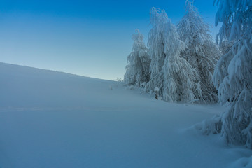 Fantastic winter mountain landscape glowing by sunlight