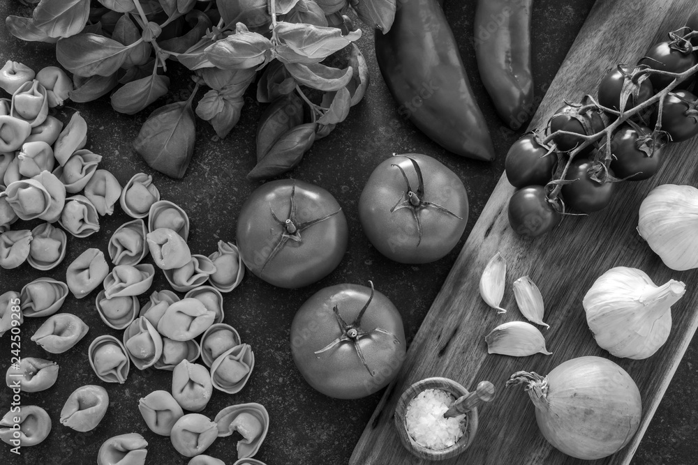Wall mural italian food ingredients. tortellini pasta, herbs and vegetables. black and white photo. - Wall murals