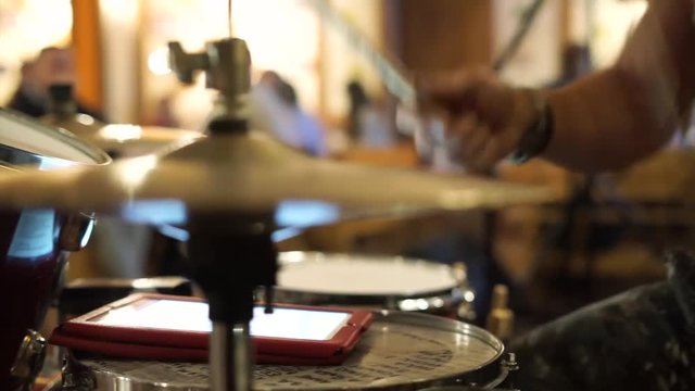 drummer playing in a cafe