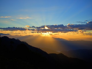 The panoramic landscape of the dawn with flare of light at horizon in Nan, Thailand