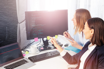 Two businesswomen have a meeting in office