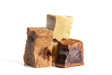 Pieces of handmade soap isolated on white.