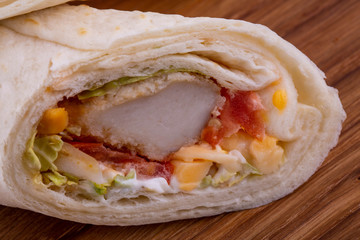 A beater fish with vegetables and mayonnaise