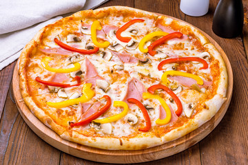 Pizza with ham and mushrooms and pepper