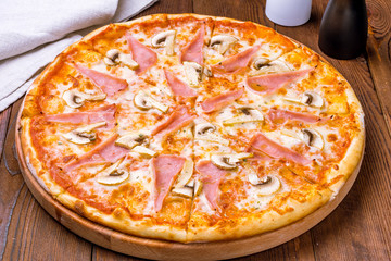 Pizza with ham and mushrooms