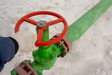 Horizontal view of a wellhead with valve armature. Oil and gas industry concept.  Oil valve with...