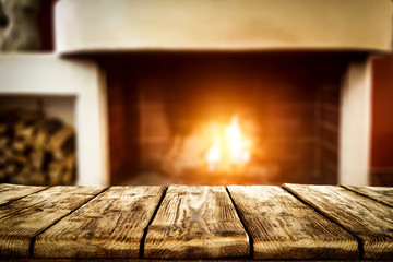 Wooden table of free space and fireplace 