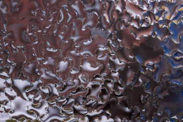 Water drops on glass window close up with blurred background. Drops in macro. Condensate on window...