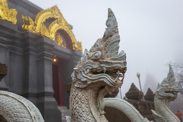 Sinakarintra Stit Mahasantikhiri Pagoda in a beautiful foggy morning