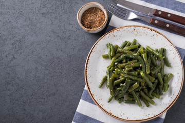 Fried green beans with garlic and pepper. Top view. Copyspace