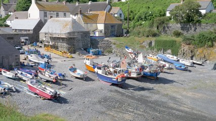 Fishing boats on the beach of the quaint, traditional British fishing village of Cadgwith in Cornwall.