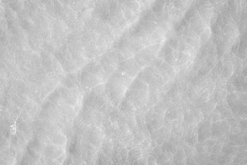 Transparent crystal sea water surface in summer. Black and White tone.