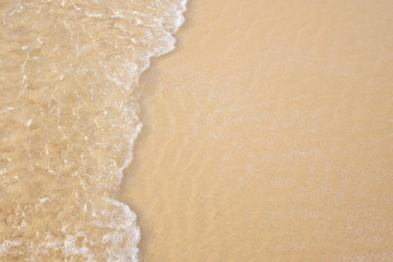 Wave on the sand beach background