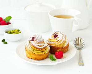 puff pastry with pistachios and raspberries.