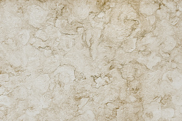 Old beige stone granite wall background texture