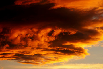 Naklejka na ściany i meble Beautiful cloudy in sunset