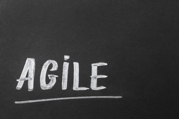 Word AGILE on dark background