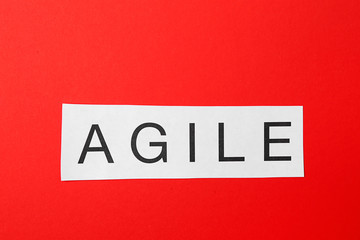 Word AGILE on color background