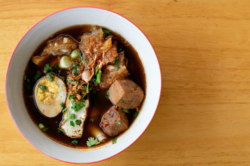 Paste of rice flour or kuay jab on wooden table,  Delicious Thai food.