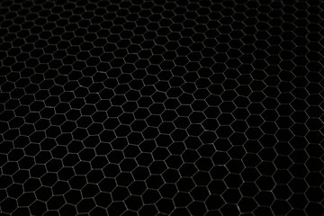 Texture of metal mesh on dark background