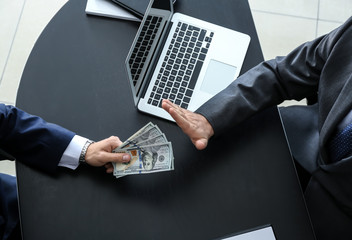 Businessman refusing to take bribe in office. Concept of corruption