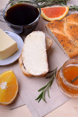 Slice of white bread with butter and a cup of black coffee. Food for breakfast