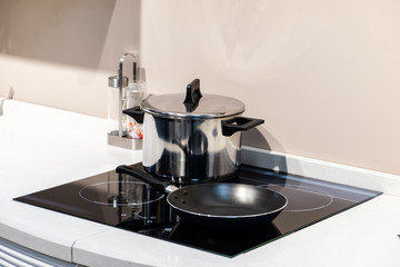 Black glass induction hob in the kitchen