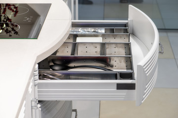 drawer with plates in a modern kitchen