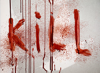 Word KILL written in blood on wall