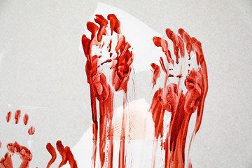 Bloody palm prints on wall