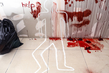 Crime scene with victim silhouette and word HELP written in blood on wall