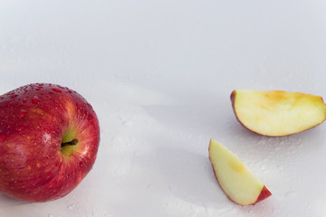 Top view of crispy red apples on white background, space for text.  Healthy eating, agricultural industry concept