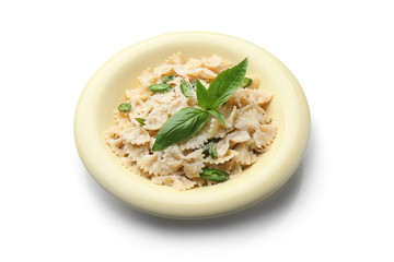 Plate with tasty pasta on white background